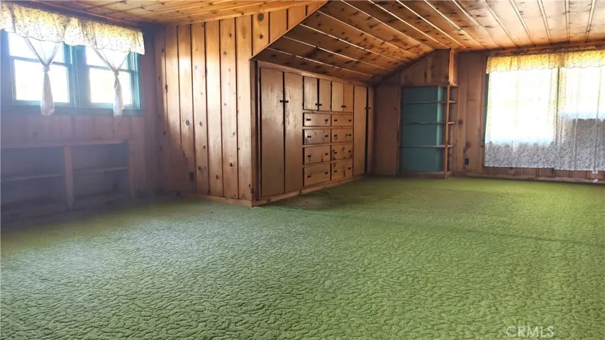 Upstairs bedroom with many closet spaces
