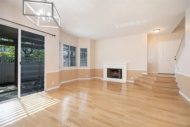 Living and dinning area leads to spacious private covered patio.
Stairs are hard wood.