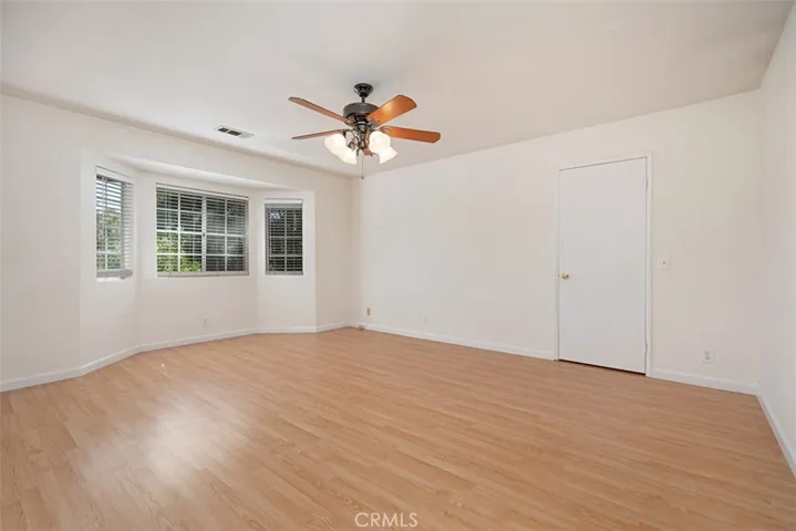 Main Bedroom with walk in closet. Vinyl Flooring.