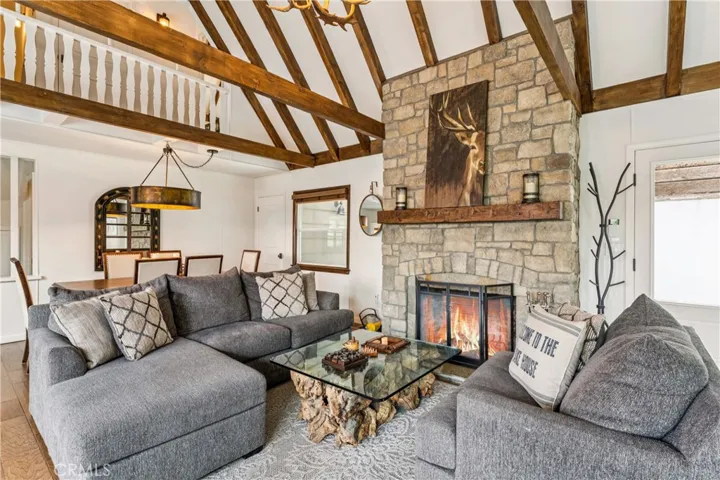 Stone fireplace centers the room