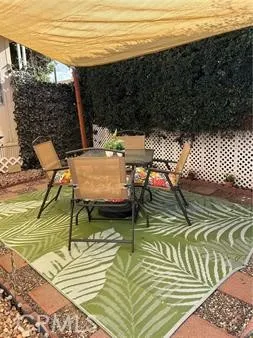 Covered back patio for relaxing and coffee
