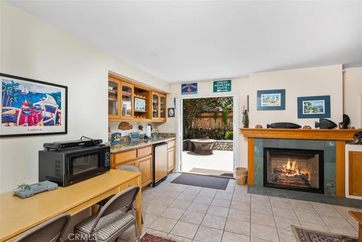 First level family Room with Fireplace. Doors to Backyard