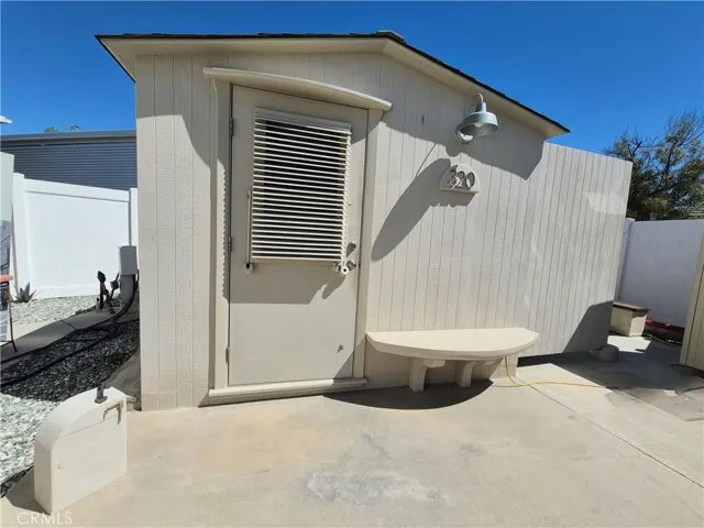 Fully customized shed with cooling system and sliding glass door.