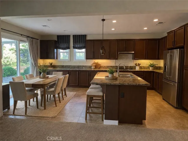 Digitally Enhanced - added furnishings to kitchen area