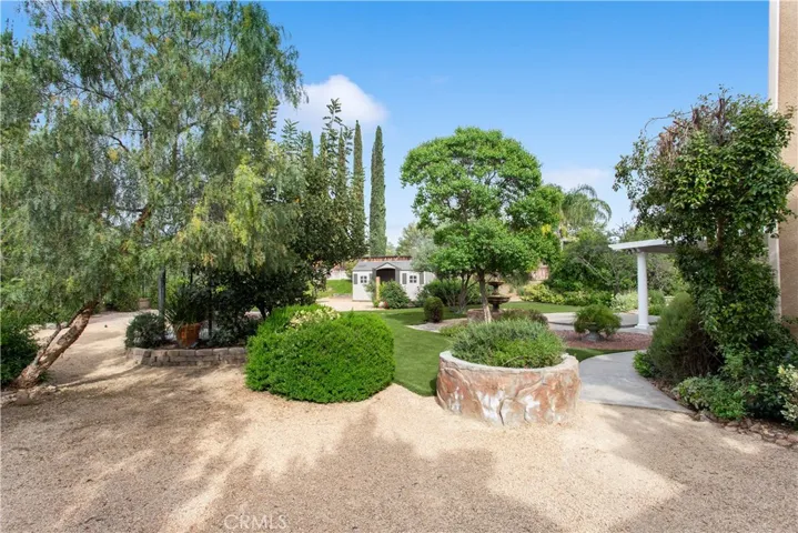 This is the area that extends from the additional rollup garage door leading to the backyard