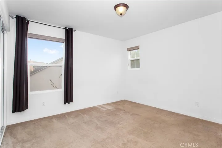 Bedroom #4 with peek-a-boo window to front of home