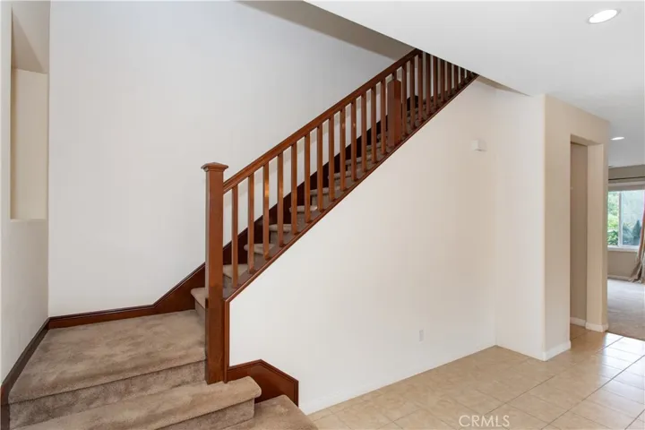 Upgraded stairway railings - let's go upstairs. Open entry under stairway for storage. OR maybe do a built-in wine cabinet or playhouse for the kids or your pets