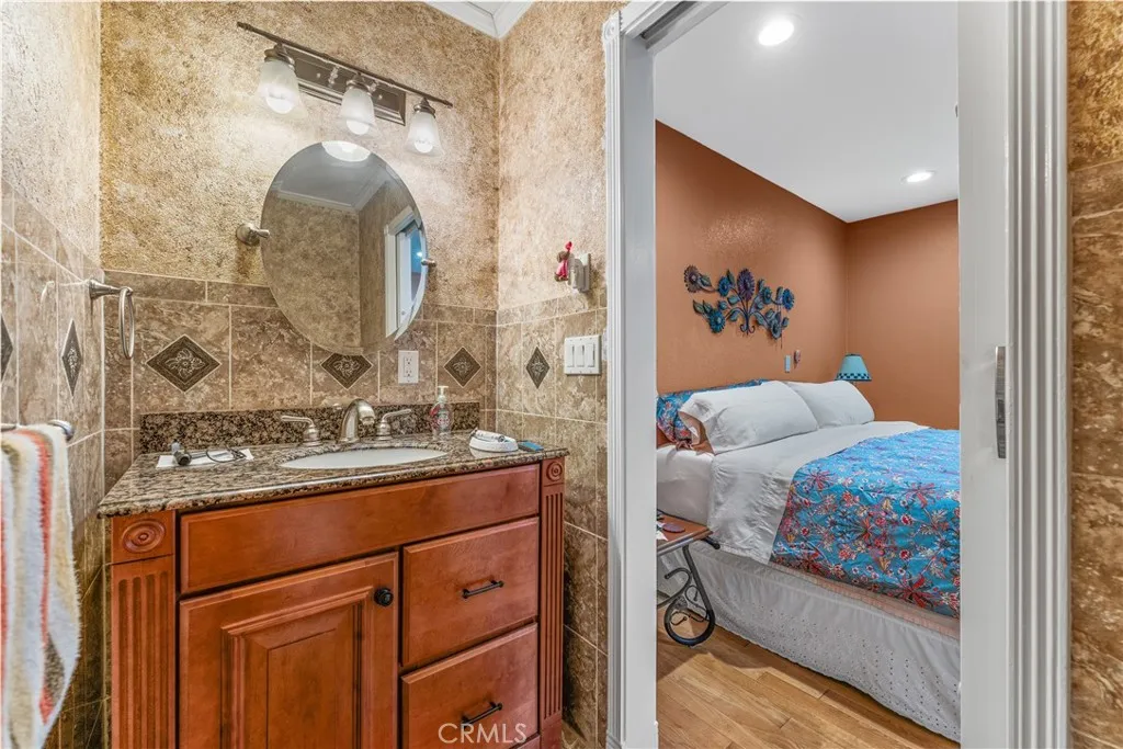 Downstairs bedroom with half bathroom