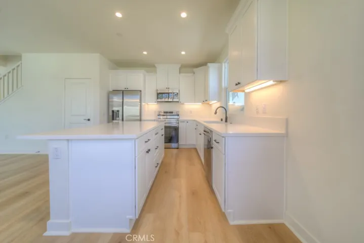 Real wood soft-close cabinetry throughout.