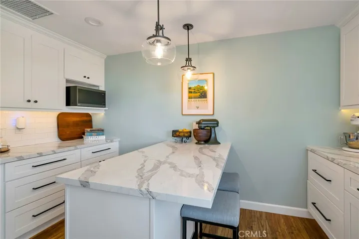 Remodeled to include kitchen island with stool seating and tons of storage!