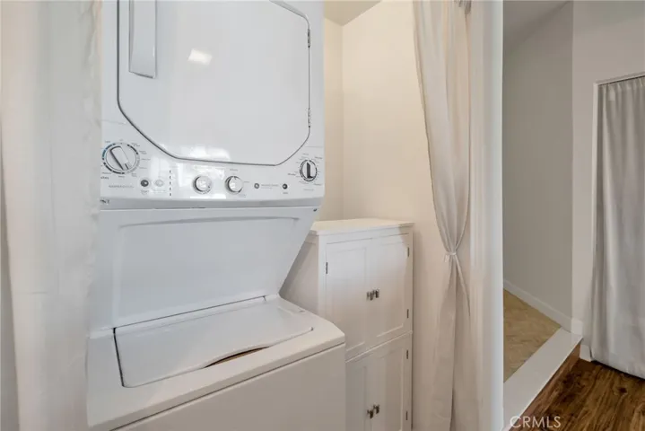 Inside Washer / Dryer with storage cabinet