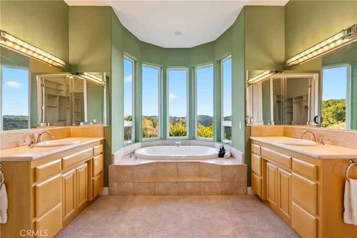 Spacious ensuite with garden tub and separate vanity areas for added comfort and of course VIEWS