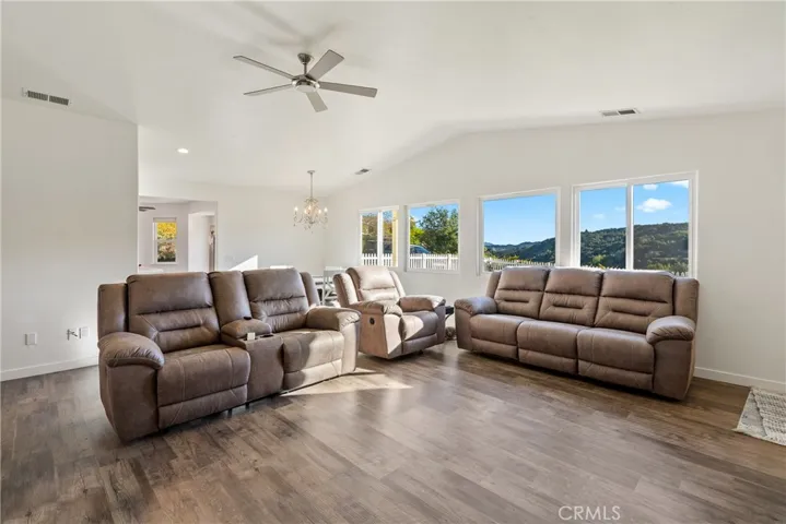 Living room with large windows capturing the scenery