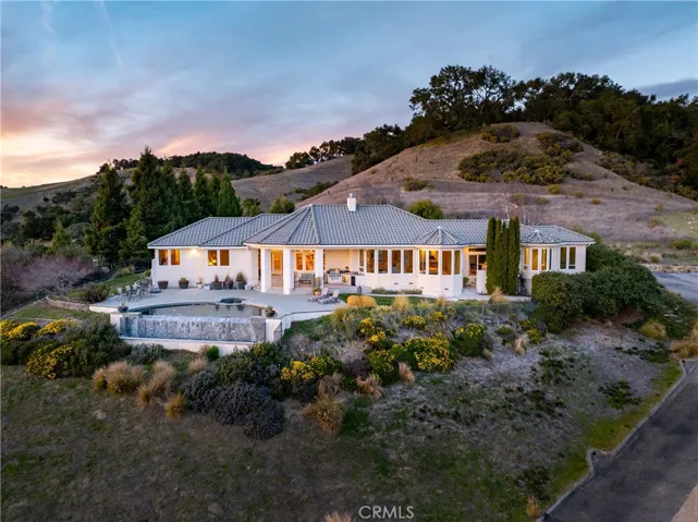 Aerial view showcasing the main residence and stunning surroundings
