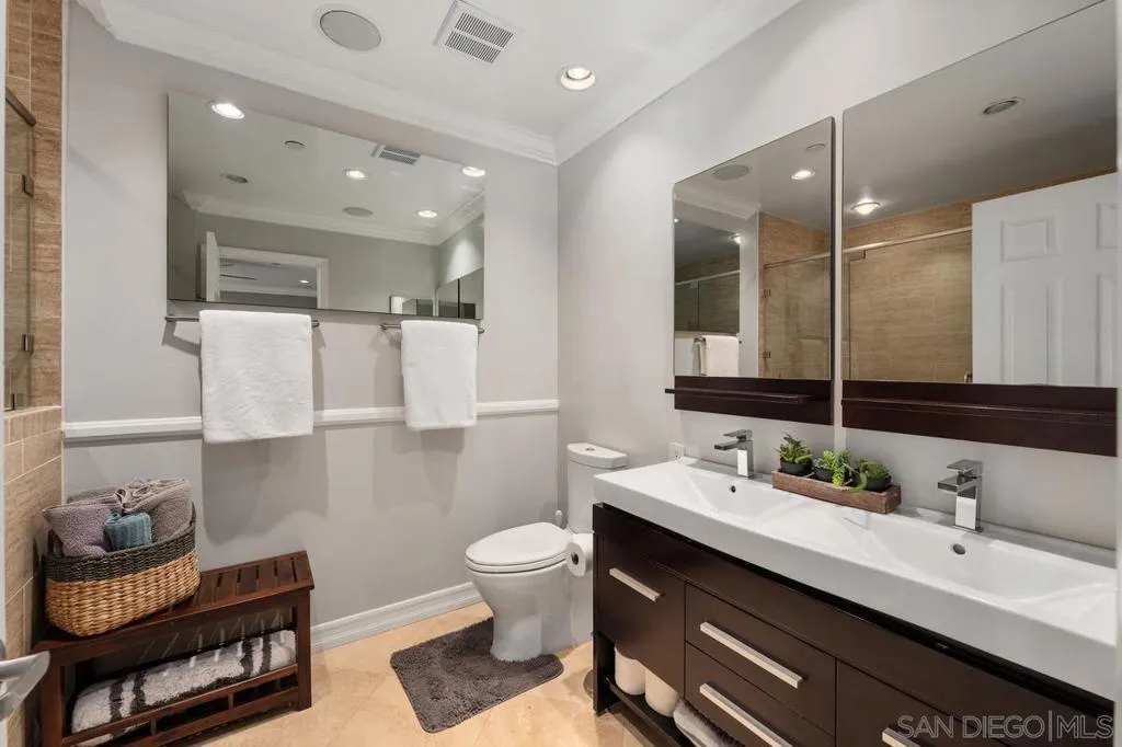 Remodeled spa-like master bath with oversized walk in shower, toiletry niche and bench for relaxing. Enjoy the dual sink vanity and plenty of storage.