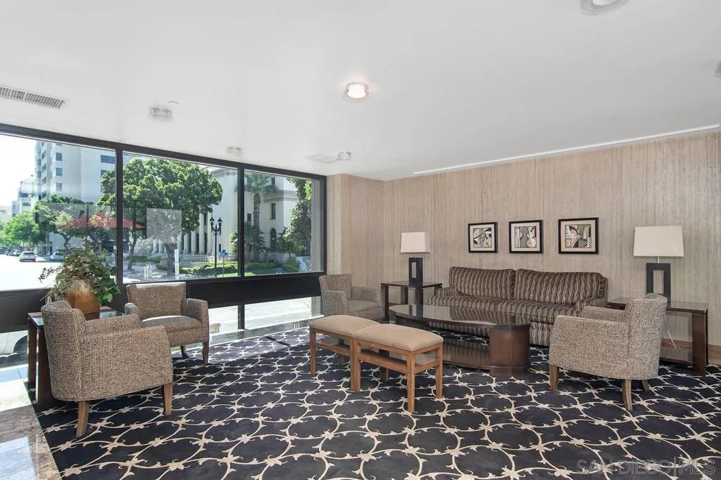 Lovely and spacious sitting area in the building overlooking the well manicured grounds.