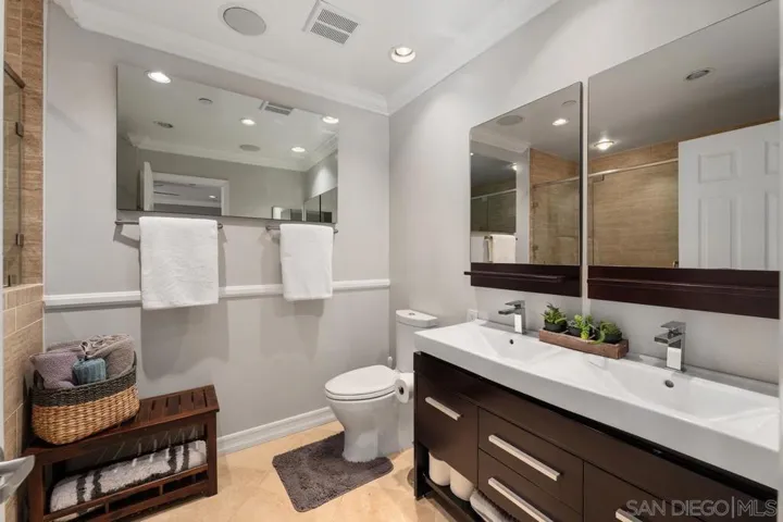 Remodeled spa-like master bath with oversized walk in shower, toiletry niche and bench for relaxing. Enjoy the dual sink vanity and plenty of storage.