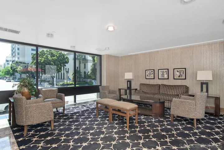 Lovely and spacious sitting area in the building overlooking the well manicured grounds.