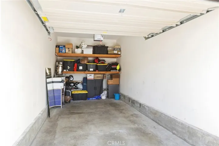 The one-car garage is just outside of the front door, first stall on the left. It has extra storage to the back.