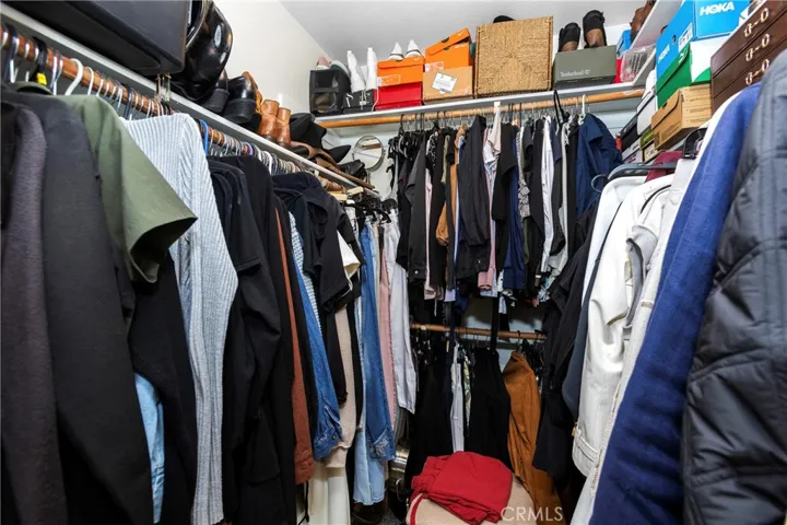 The walk in closet in the primary bedroom suite
