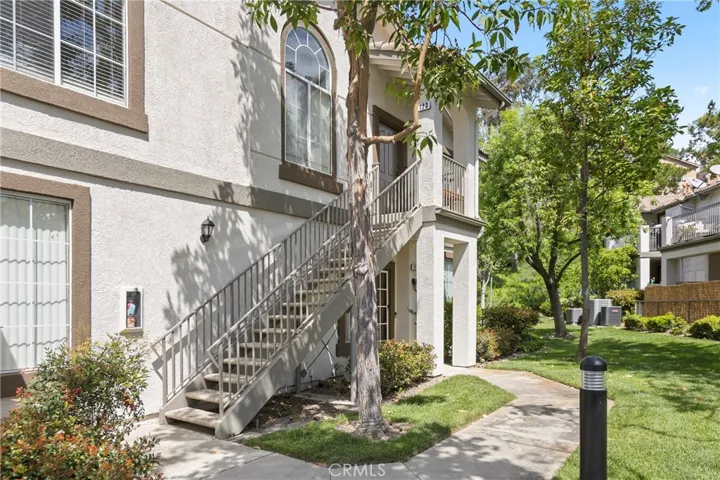 Welcome home to 123 a 2 bedroom, 2 full bath upper end unit with a view from the patio and a 1-car garage