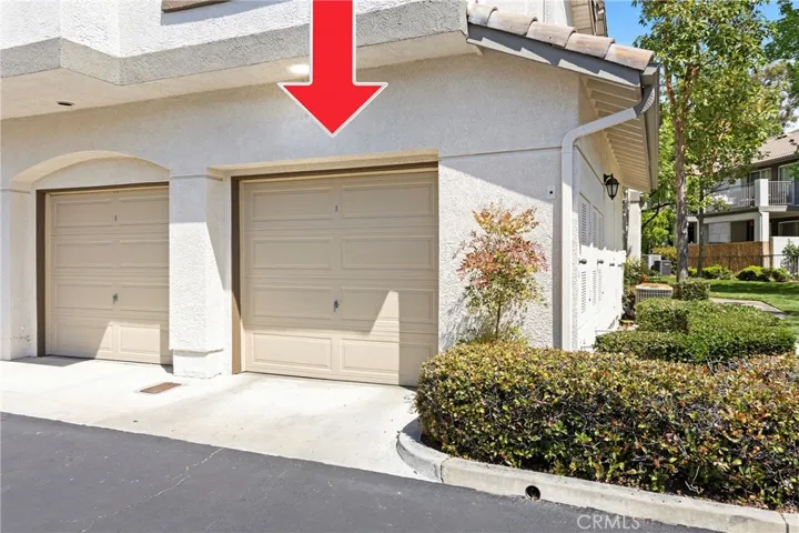 The one-car garage is just outside of the front door, first stall on the left.