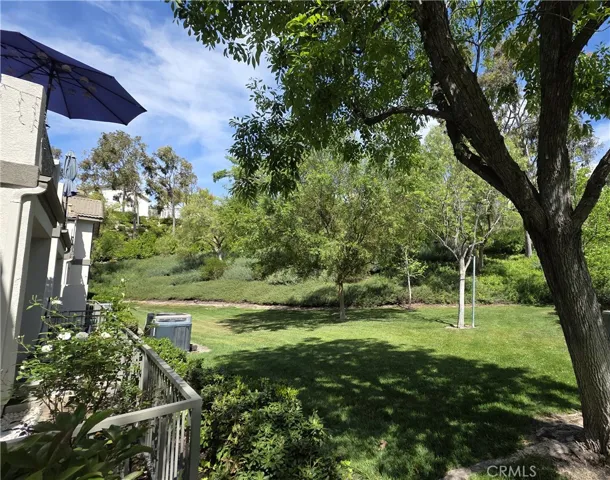 The greenbelt has the birds, mature trees, manicured hedges, and flowers for you to enjoy.