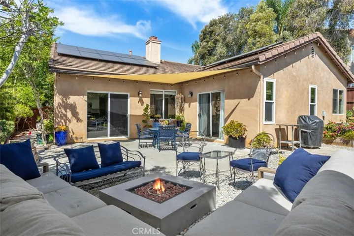 Patio and with sliders access from Kitchen and Primary Bedroom