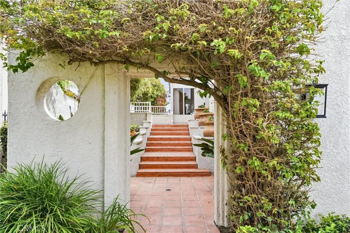 Arched Bougainvillea Entry To The Front Steps