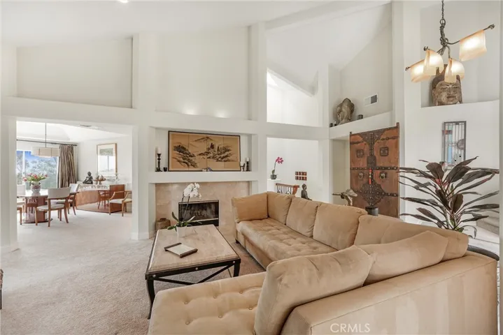 The Light Filled Living Room Has A Gas Burning Fireplace.