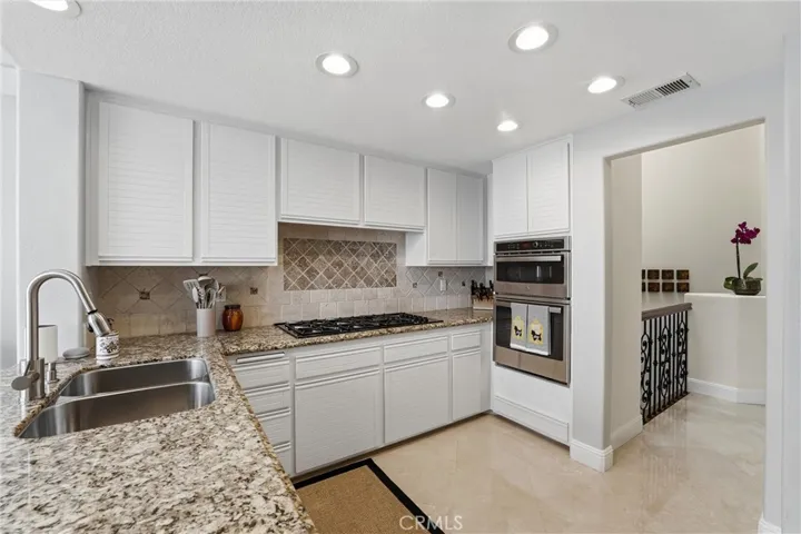 Kitchen Back Splash Is Designed With Tumbled Travertine