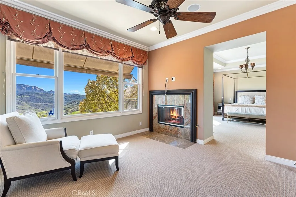 Primary Suite Retreat with Sitting Area and Two-Way Fireplace