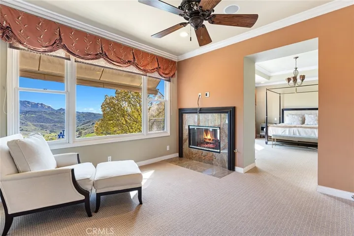 Primary Suite Retreat with Sitting Area and Two-Way Fireplace