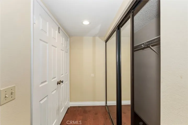 1st double closet in primary bedroom