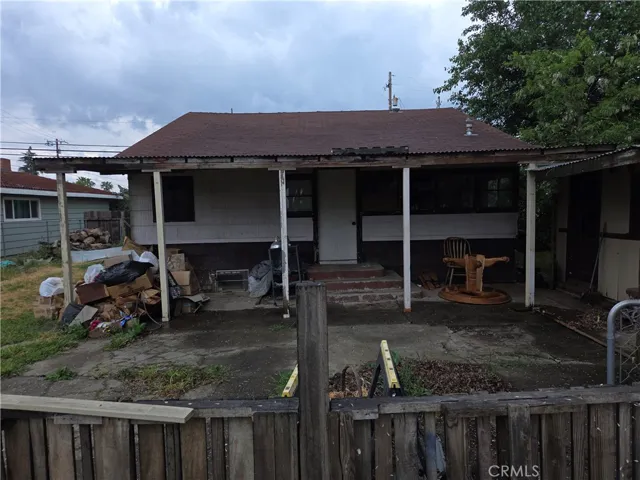 Back of house and covered patio.