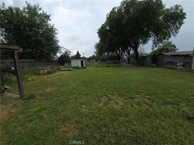 Back yard and pump house metal shed.