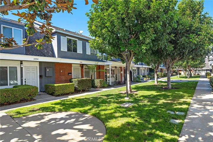 Nestled on a quiet and scenic courtyard. This unit offers a rare front porch too.