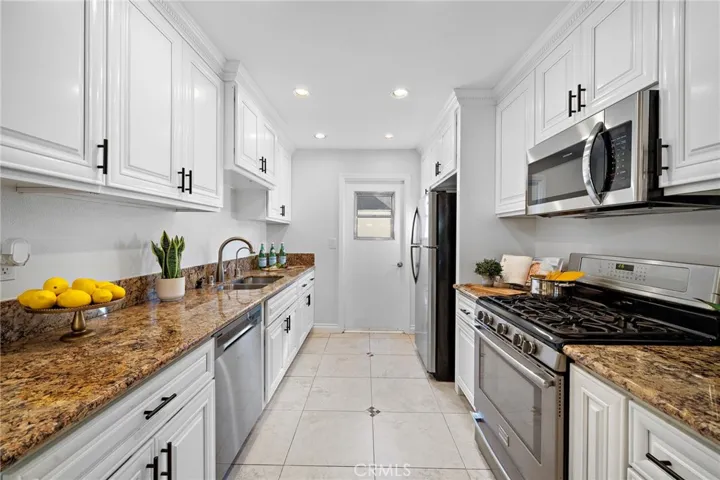 White cabinetry with soft-closing drawers and doors