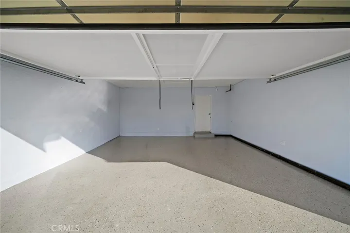 Finished garage with screen that pulls down for air flow/bonus space