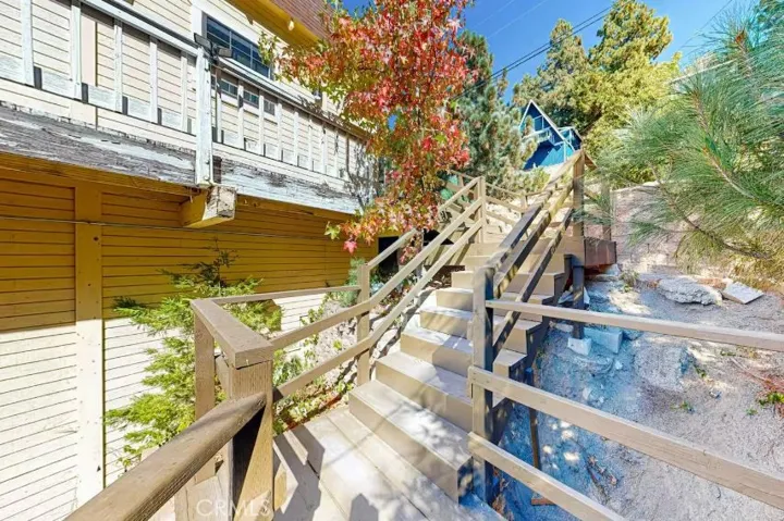 From the street level, theres a set of stairs to come down to the log cabin