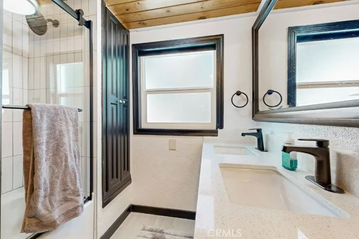This is the shared 2nd floor full bathroom with dual vanities
