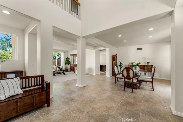 Formal entry way/foyer with 2-story ceilings and plenty of natural light