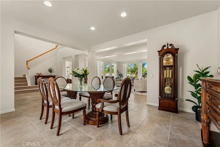FORMAL DINING SPACE WITH PLENTY OF NATURAL LIGHT AND DIRECT ACCESS TO FRONT COURTYARD