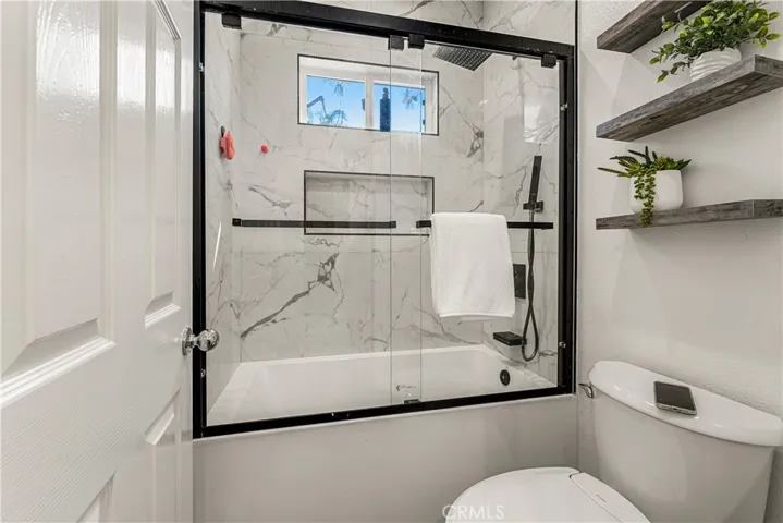 REMODELED SECONDARY BEDROOM UPSTAIRS WITH PRIVACY TUB/SHOWER ENCLOSURE AND DUAL SINKS