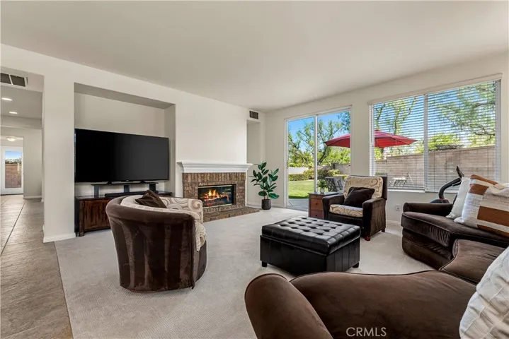 VERY SPACIOUS FAMILY ROOM OFF THE BREAKFAST NOOK AND KITCHEN WITH DIRECT ACCESS TO MASSIVE BACKYARD!