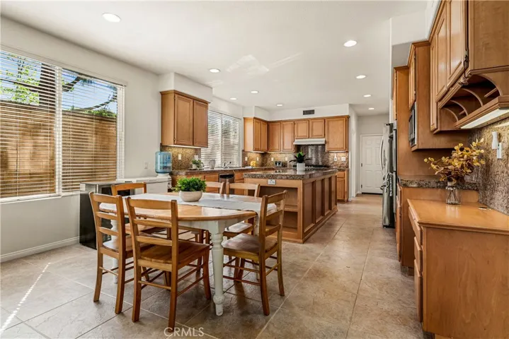 BREAKFAST NOOK OFF THE LARGE KITCHEN WITH BUILT IN DESK TO THE RIGHT