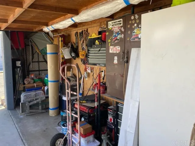 Garage door still intact. Space in front of non permanent wall . Can be removed for full access.