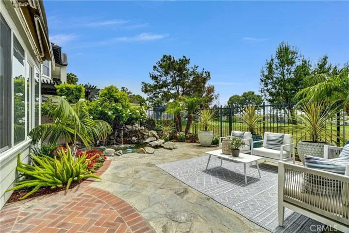 Enjoy the sunny backyard and tranquil fountain