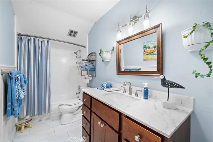 The secondary bathroom is beautifully remodeled