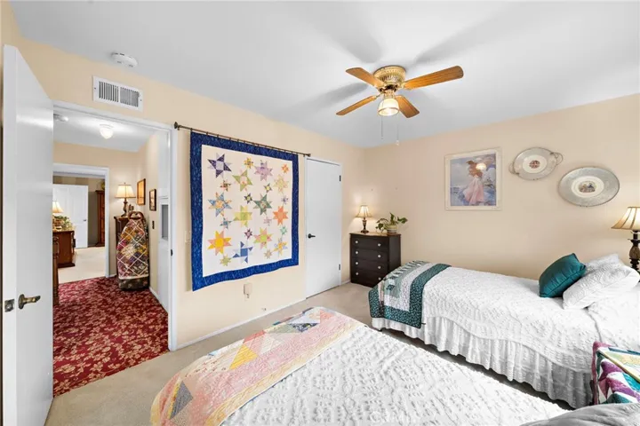 Upstairs secondary room with ceiling fans